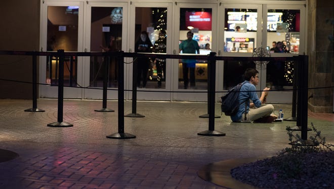 Fans wait to see the "Rogue One: A Star Wars Story" movie premiere at the Harkins theater at Tempe Marketplace on Thursday, Dec. 15, 2016.