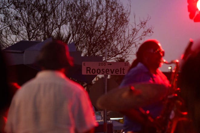 A band plays as people fill the street for the First Friday art walk on Roosevelt Row on Aug. 4, 2023, in downtown Phoenix.