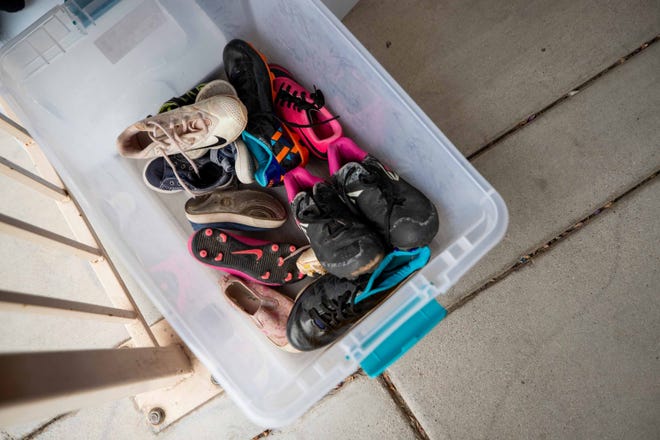 Shoes lay in a bin, waiting to be picked up, outside the Three Precious Miracles office in Sacaton on Nov. 30, 2023.