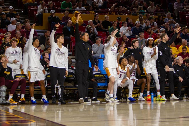 ASU sideline reacts to a 3-point score at Desert Financial Arena in Tempe on Dec. 6, 2023.