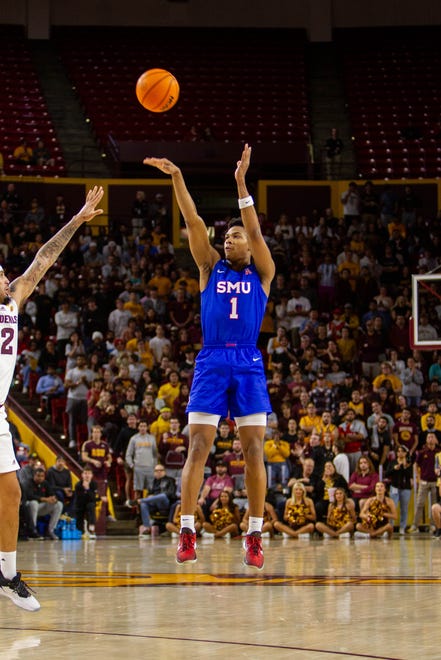 Zhuric Phelps (1) jumps to shoot at Desert Financial Arena in Tempe on Dec. 6, 2023.