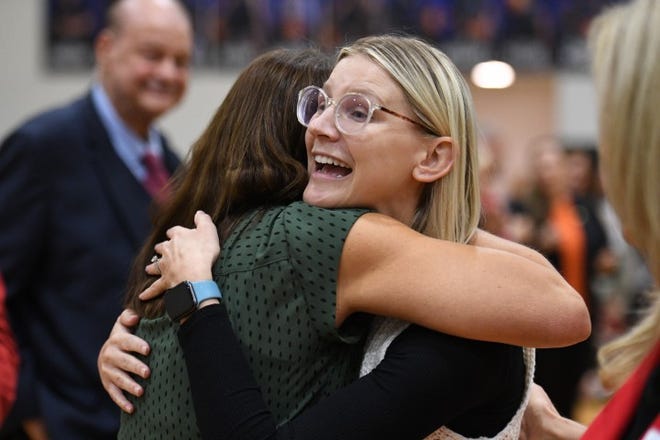 Milken Educator Award winner Ashley Meyer hugs Horizon Honors Elementary School Executive Director Betsy Fera after Meyer's win on Dec. 7 2023.