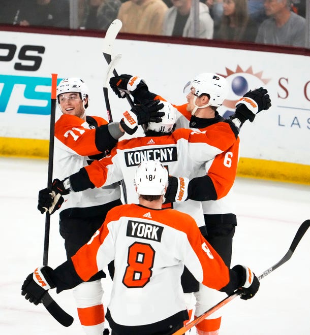 Philadelphia Flyers right wing Travis Konecny (11) celebrates after scoring a goal against the Arizona Coyotes in the first period at Mullett Arena.