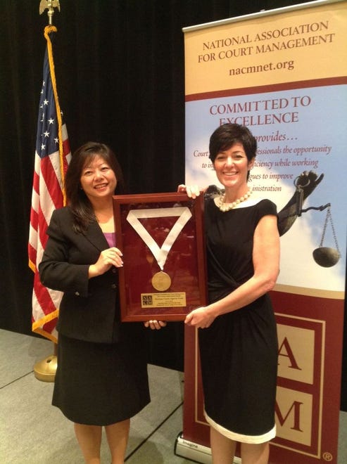 Judge Rosa Mroz (left) and Probate Administrator Elizabeth Evans
(right) accepted the Justice Achievement Award at the 2013 NACM Conference held in San Antonio, Texas.